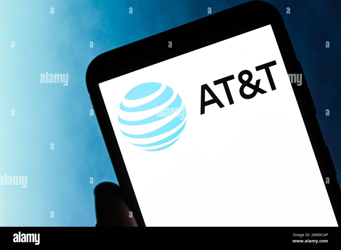 In this photo illustration an AT&T logo seen displayed on a smartphone ...