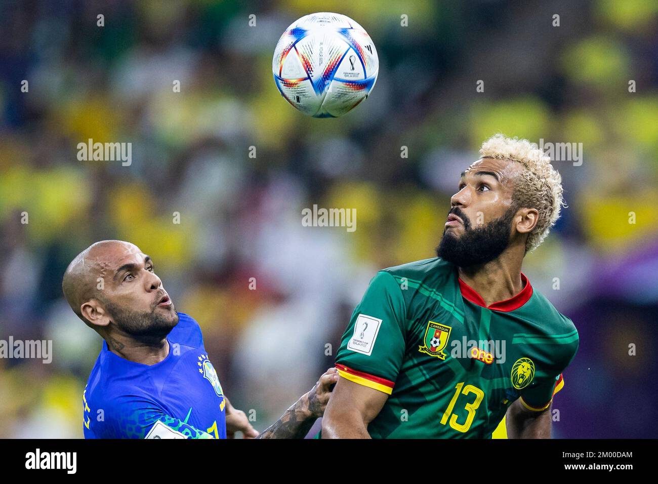 Lusail, Qatar. 02nd Dec, 2022. Soccer: World Cup, Cameroon - Brazil, preliminary round, Group G, Matchday 3, Lusail Stadium, Brazil's Dani Alves (l) in action against Cameroon's Eric Maxim Choupo-Moting (r). Credit: Tom Weller/dpa/Alamy Live News Stock Photo