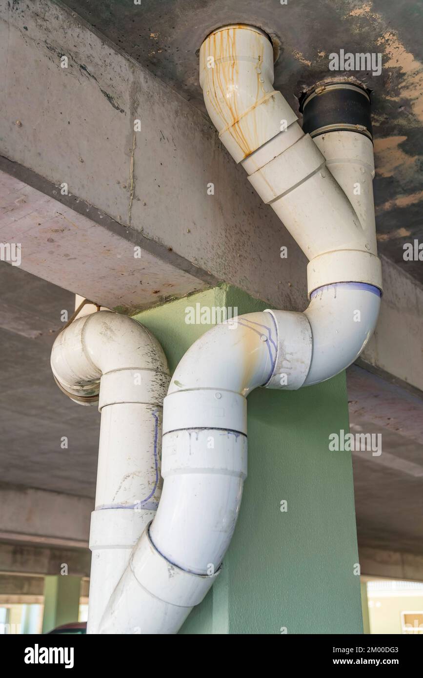 Destin, Florida White PVC drain pipes view from below on a parking