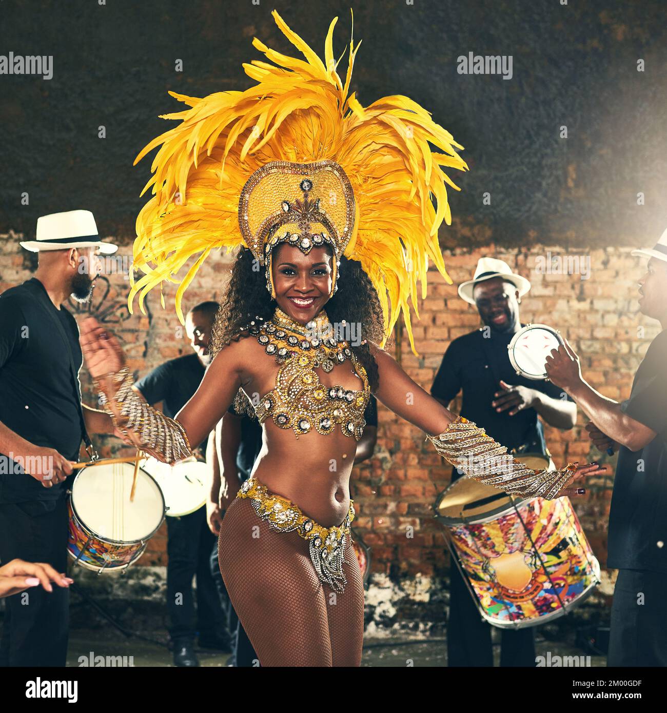 Samba, dance and black woman at Carnival to celebrate, night energy and holiday party in Rio de Janeiro, Brazil. Street band, music smile and portrait Stock Photo