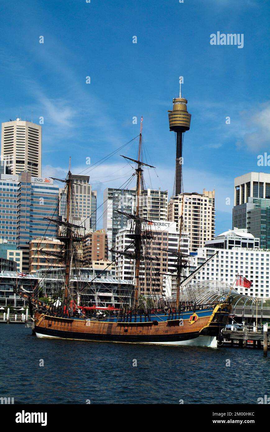 Sydney, Australia - February 11, 2008: HMS Endeavour - ship of discoverer Captain Cook, Maritime Museum in Darling Harbour and Sydney Tower aka Centre Stock Photo