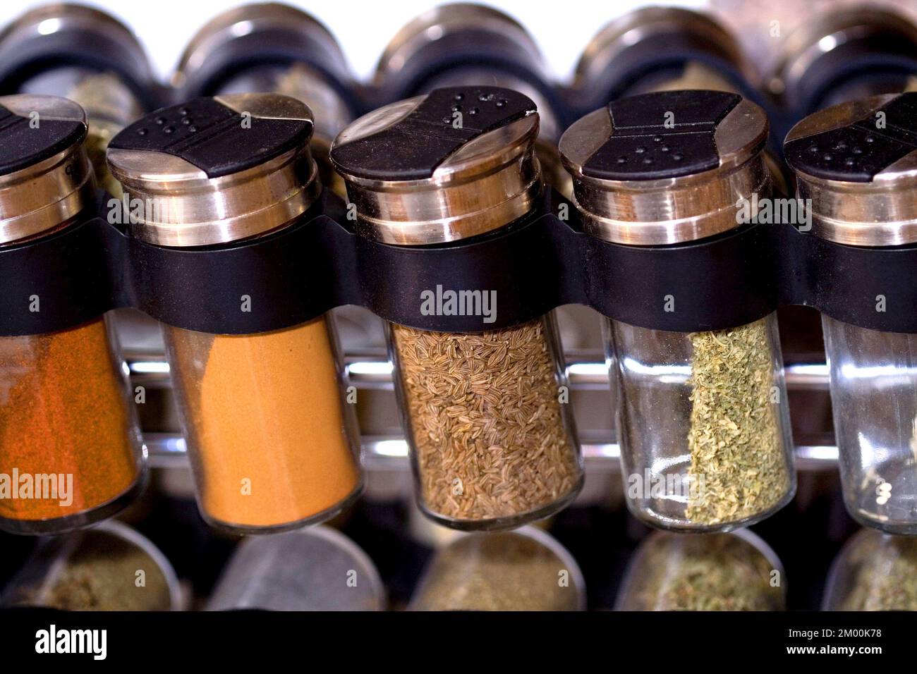Powdered spice in jars in a spice rack Stock Photo Alamy