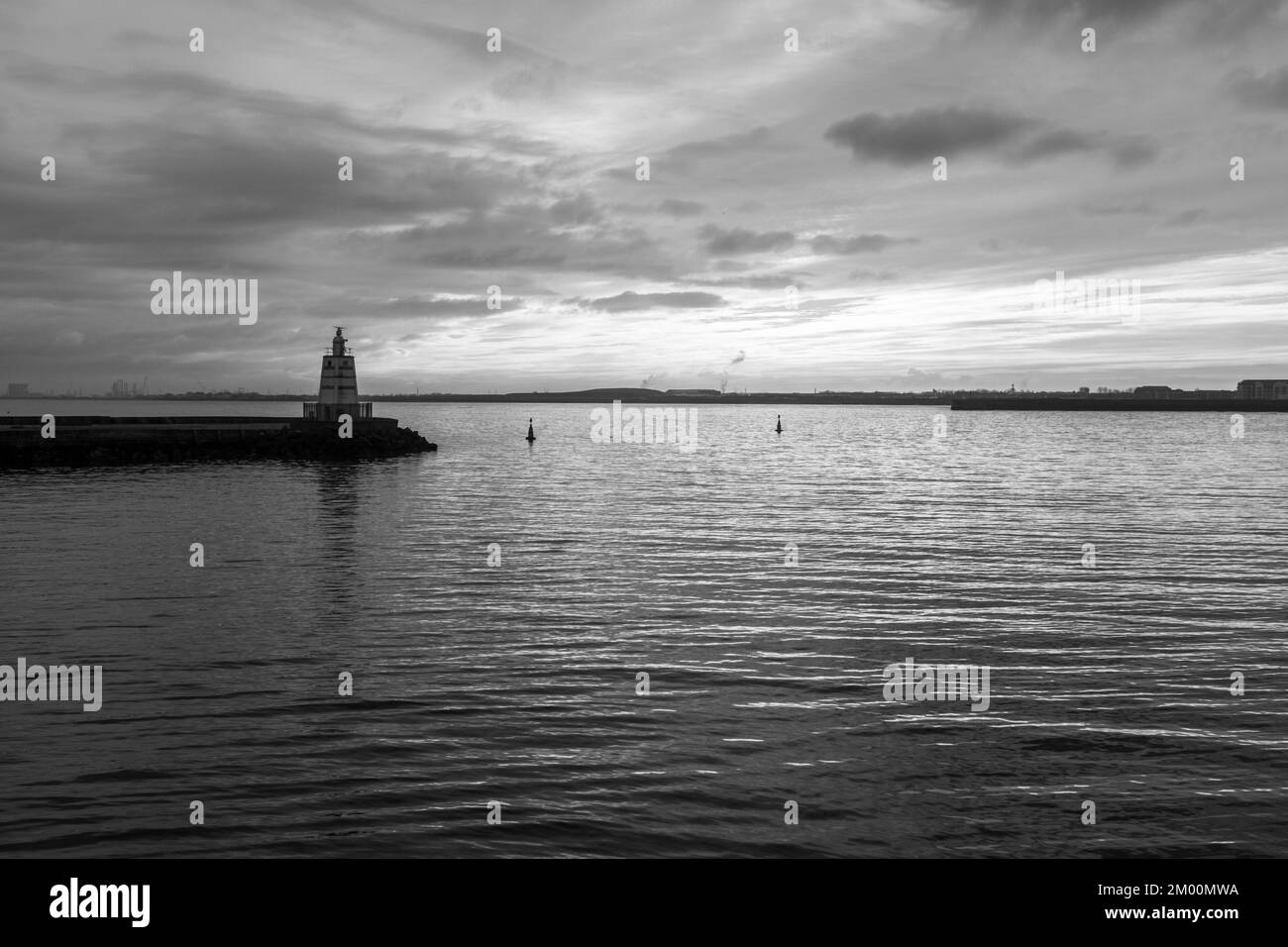 Tranquil scene at the Headland,Hartlepool,England,UK with the pier and setting sunlight . In monochrome Stock Photo