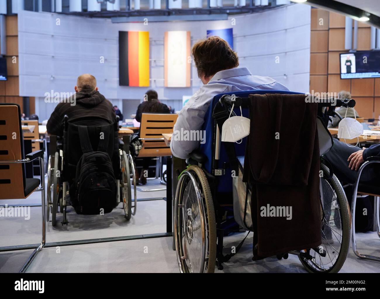 Berlin, Germany. 03rd Dec, 2022. People with disabilities sit in the