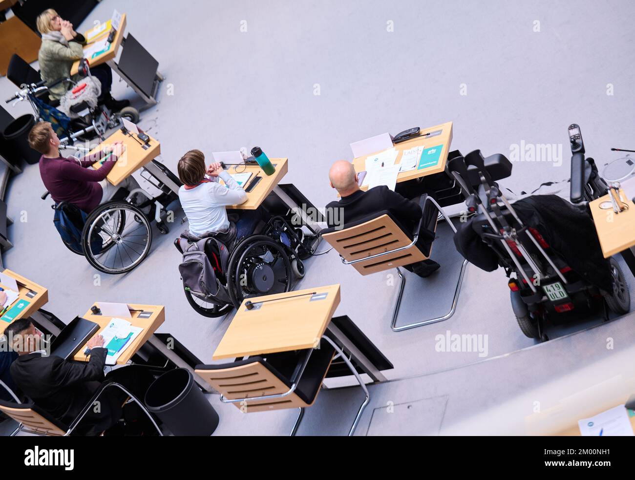 Berlin, Germany. 03rd Dec, 2022. People with disabilities sit in the