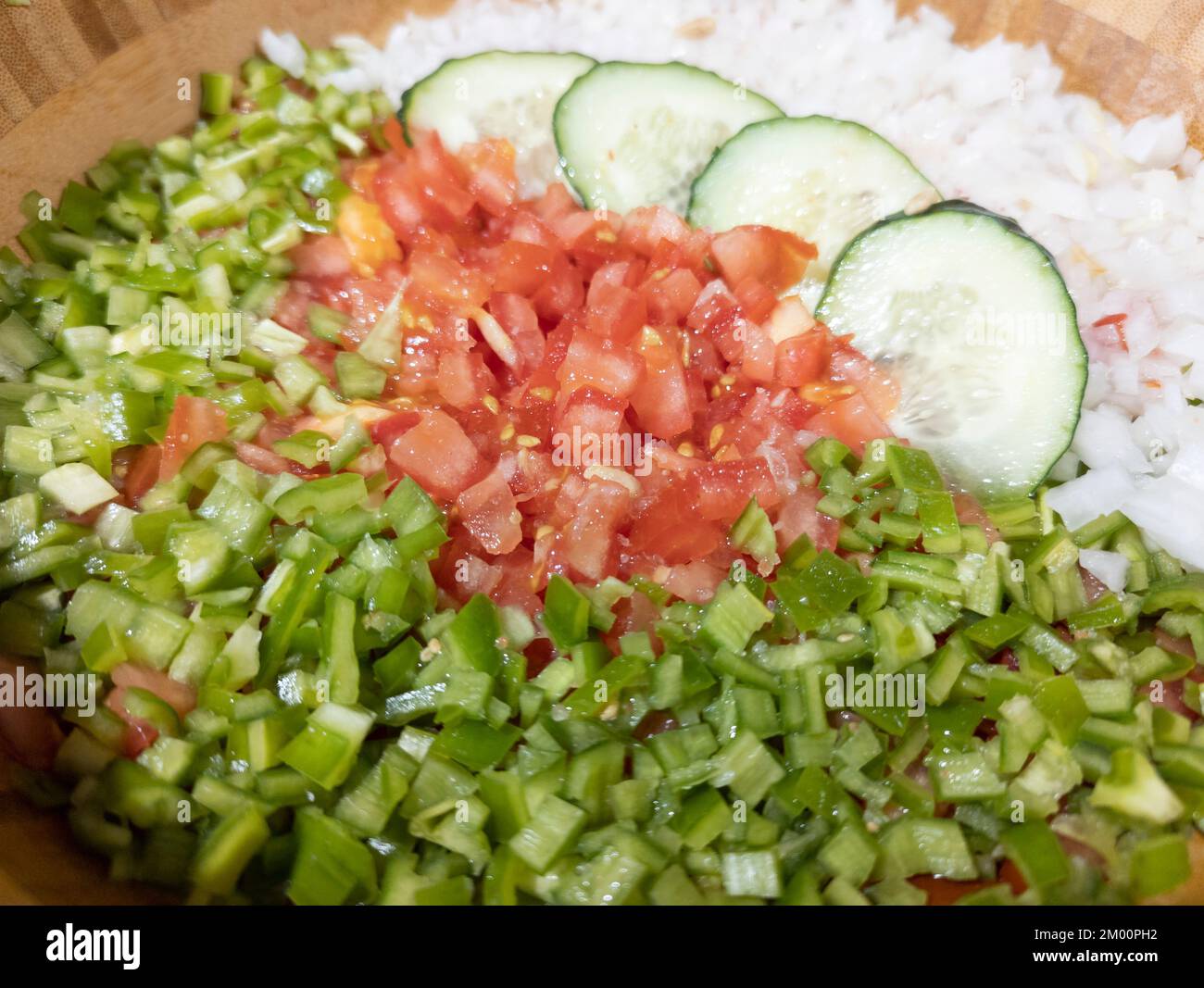 Pipirrana, typical Malaga salad, Malaga Spain, is a salad whose basic ingredients are onion, tomato, green pepper and cucumber Stock Photo