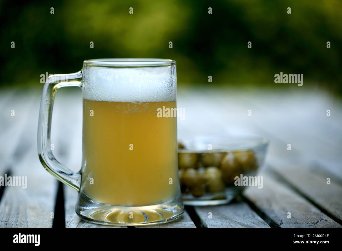 Refreshing beer with olives on the terrace Stock Photo Alamy