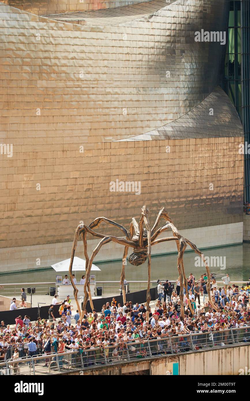 People under the Gigant Spider Titled Maman Sculpture by Louise Bourgeois located in the