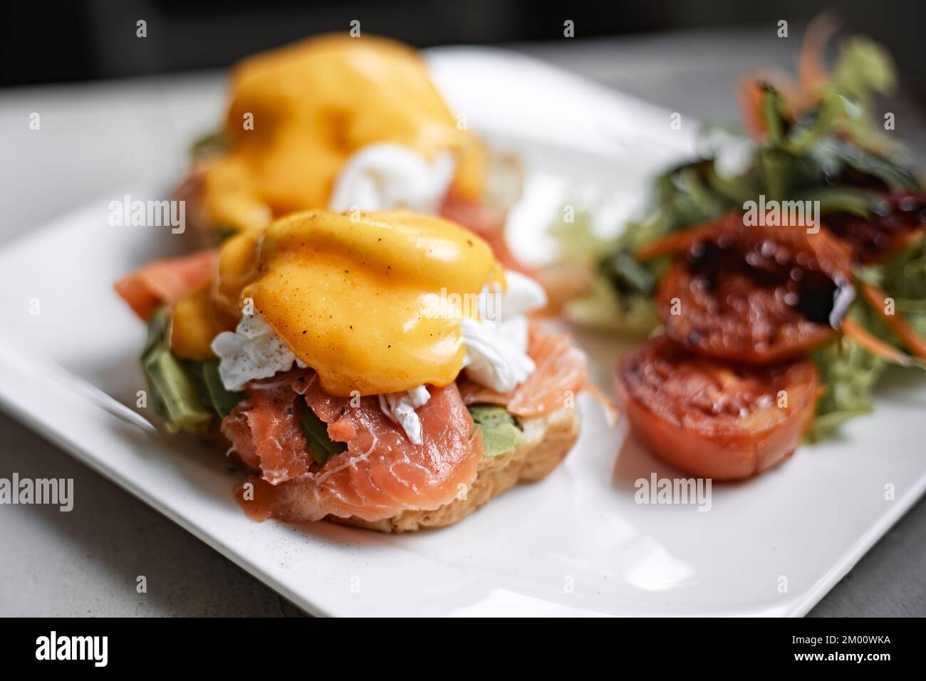 Egg benedict with avocado and smoked salmon Stock Photo Alamy