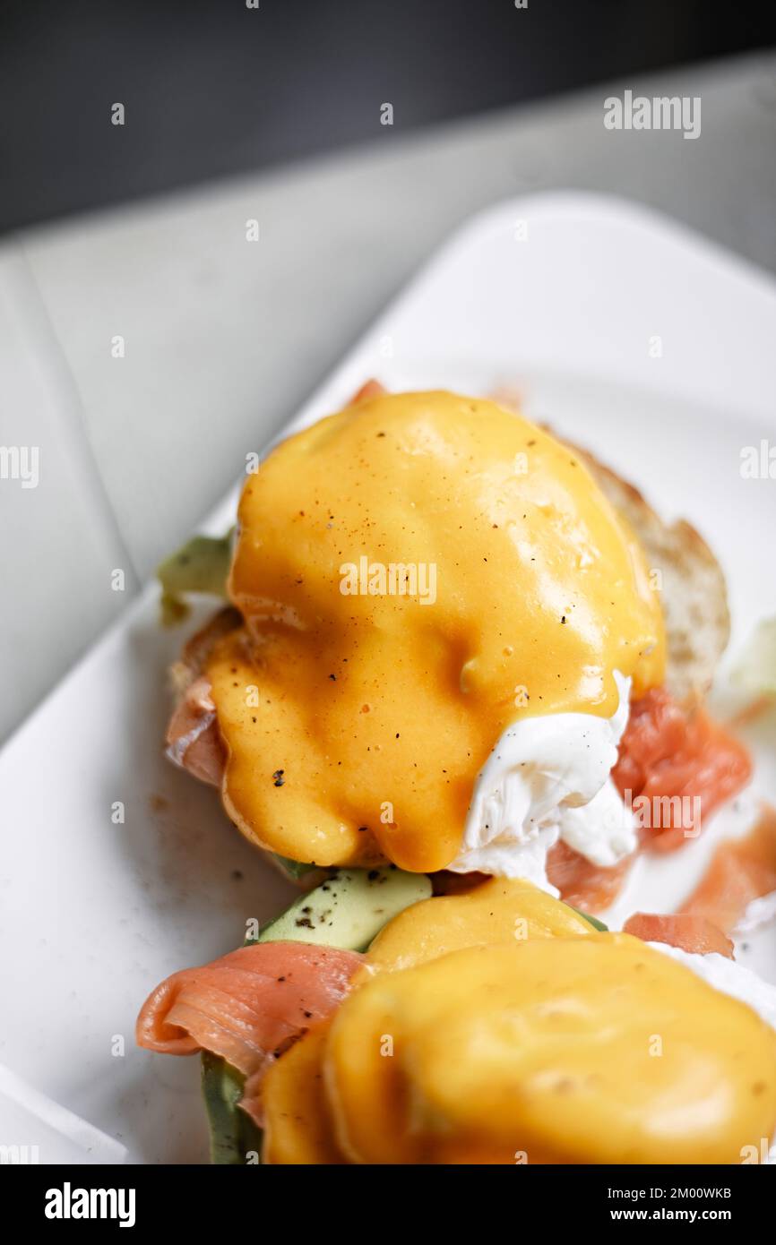 Egg benedict with avocado and smoked salmon Stock Photo Alamy