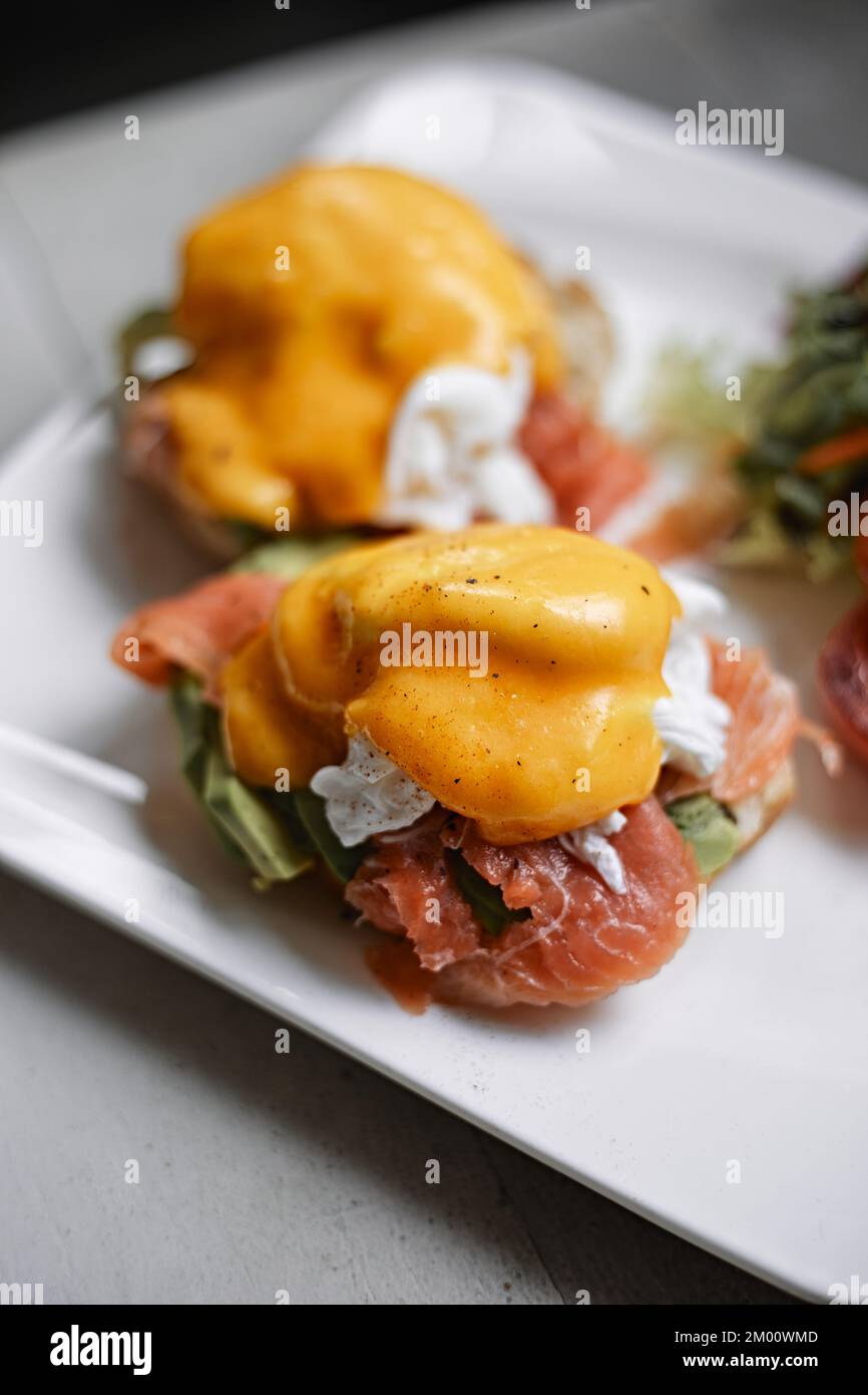 Egg benedict with avocado and smoked salmon Stock Photo Alamy