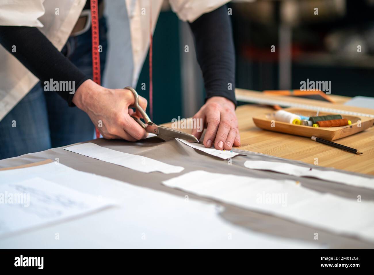 Woman With Tailor Scissors Cutting Out Fabric 39, People Stock