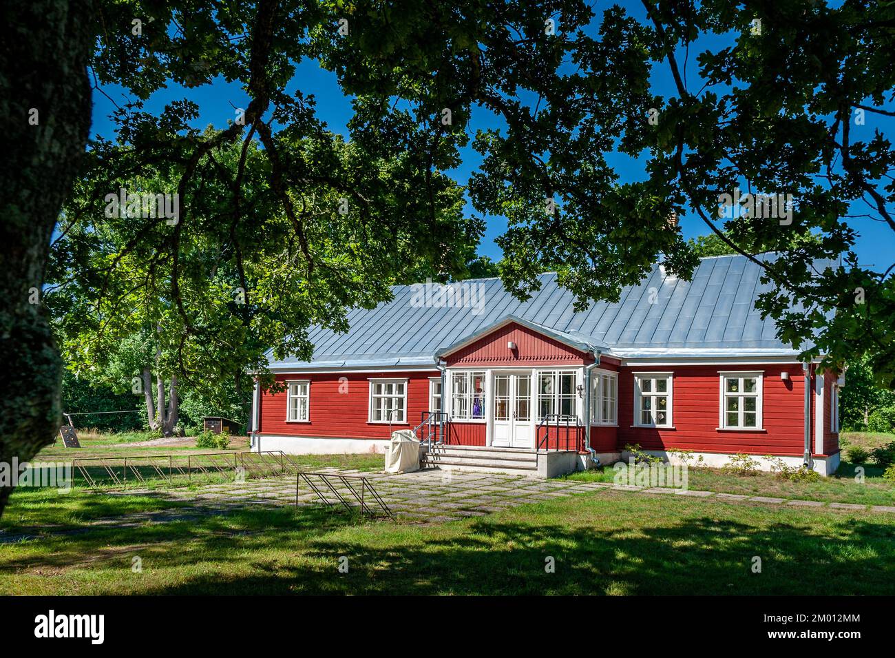 View of the Ruhnu Elementary School. Traditional wooden house and ...