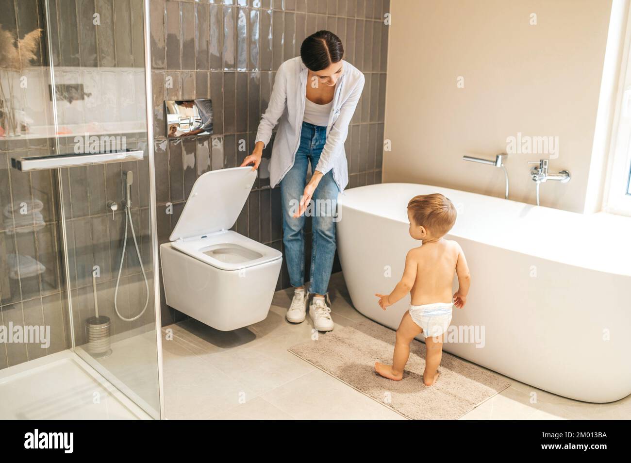 Mother toilet training child hi-res stock photography and images - Alamy