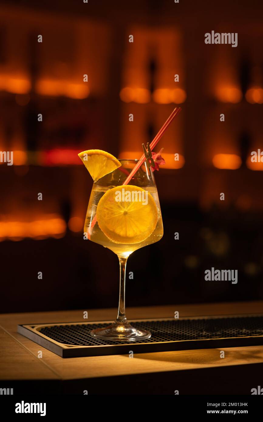 Aperol spritz cocktail served in a wine glass, decorated with slice of ...