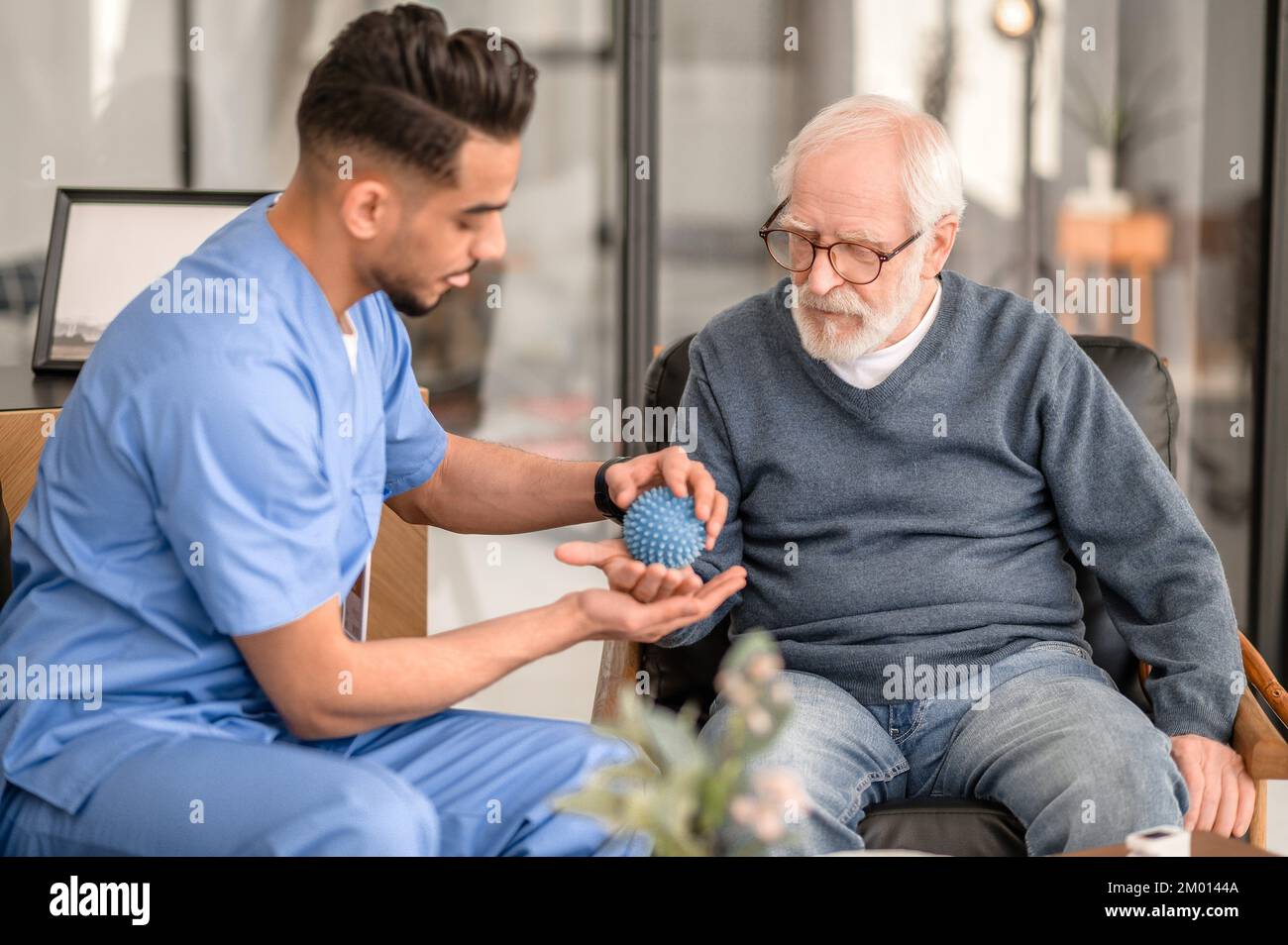 Hand massage elderly hi-res stock photography and images - Alamy