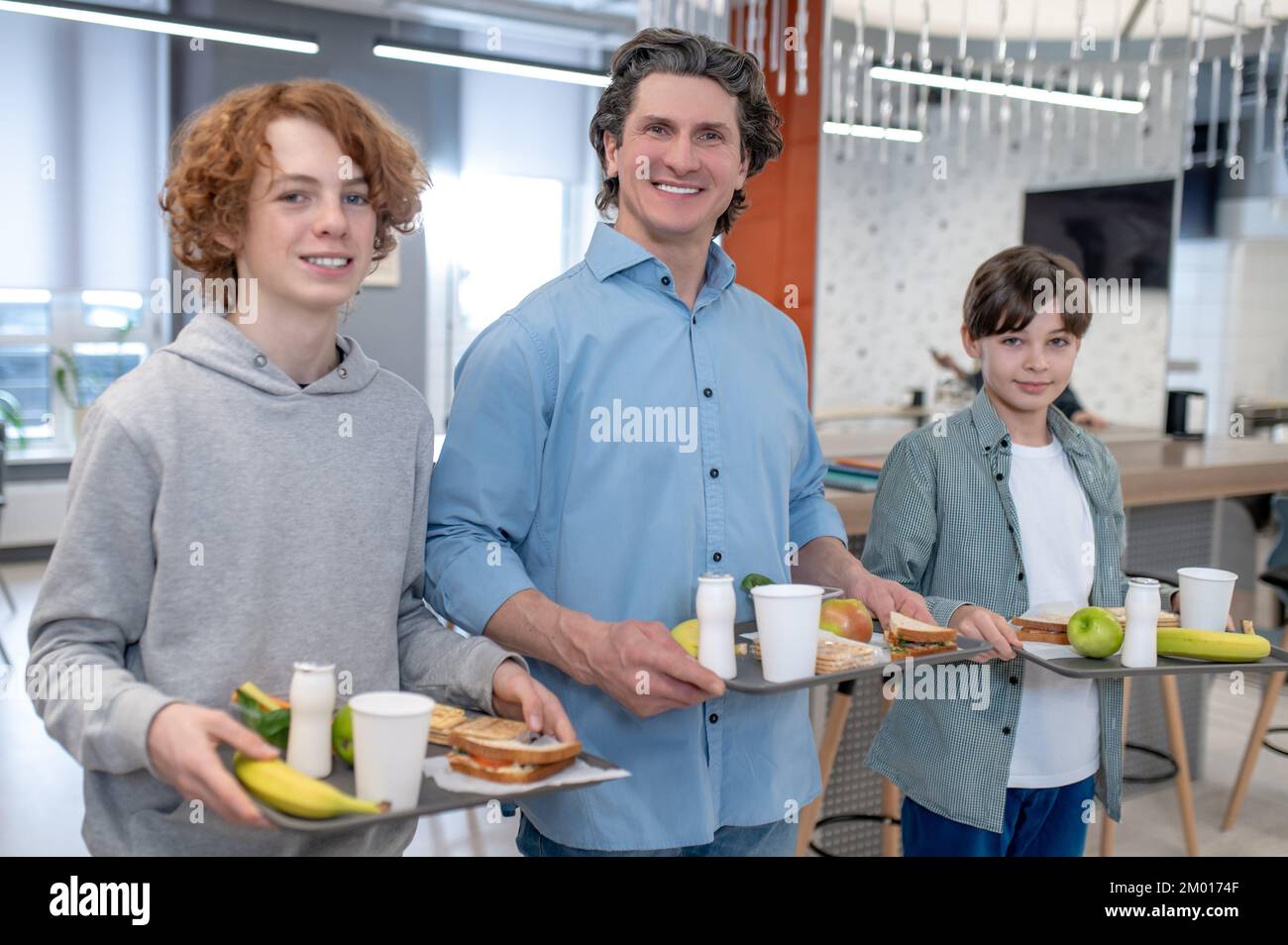 School canteen. A smiling male teacher in a school canteen Stock Photo