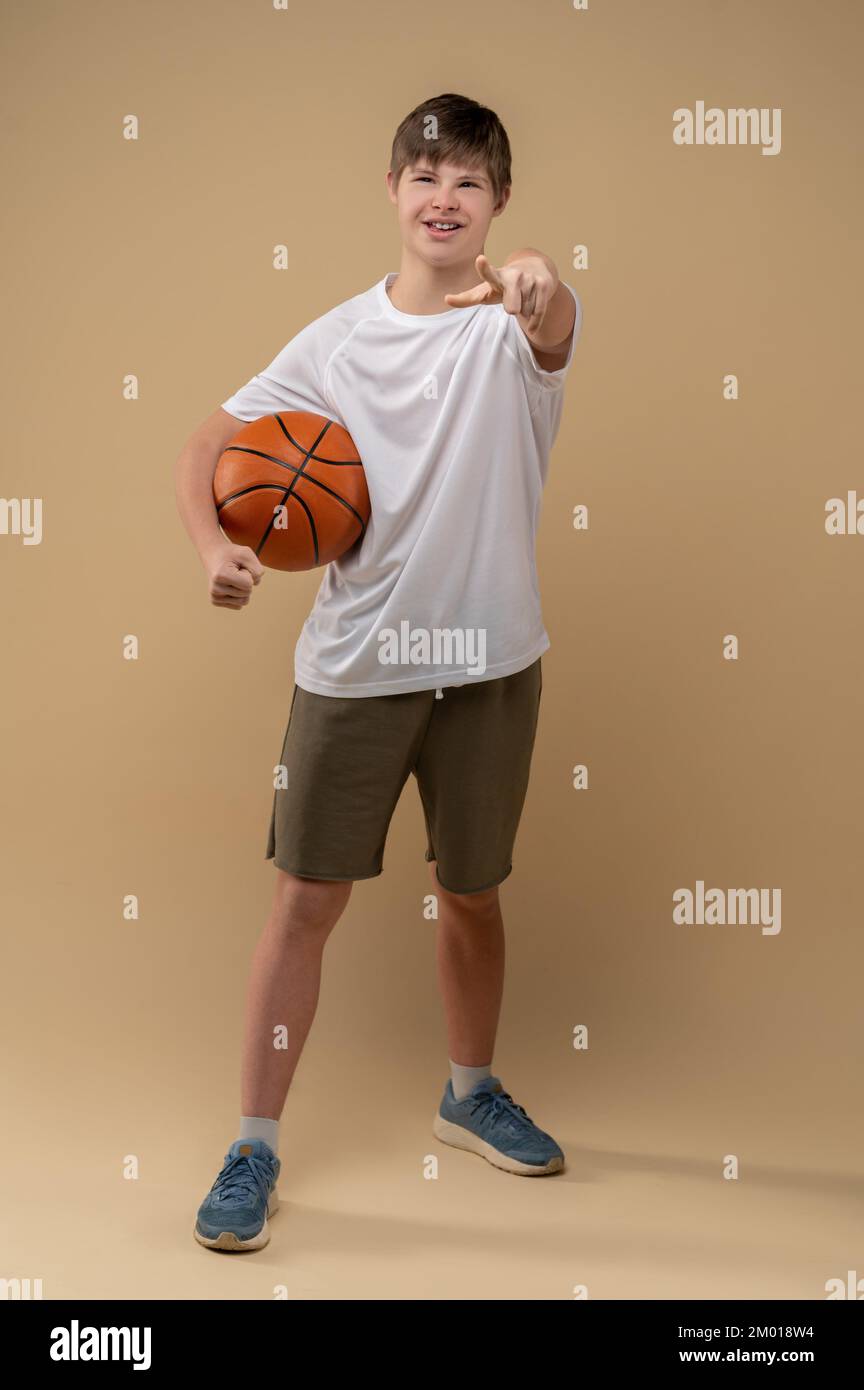 Fullsize portrait of a confident teenager with the game ball under his