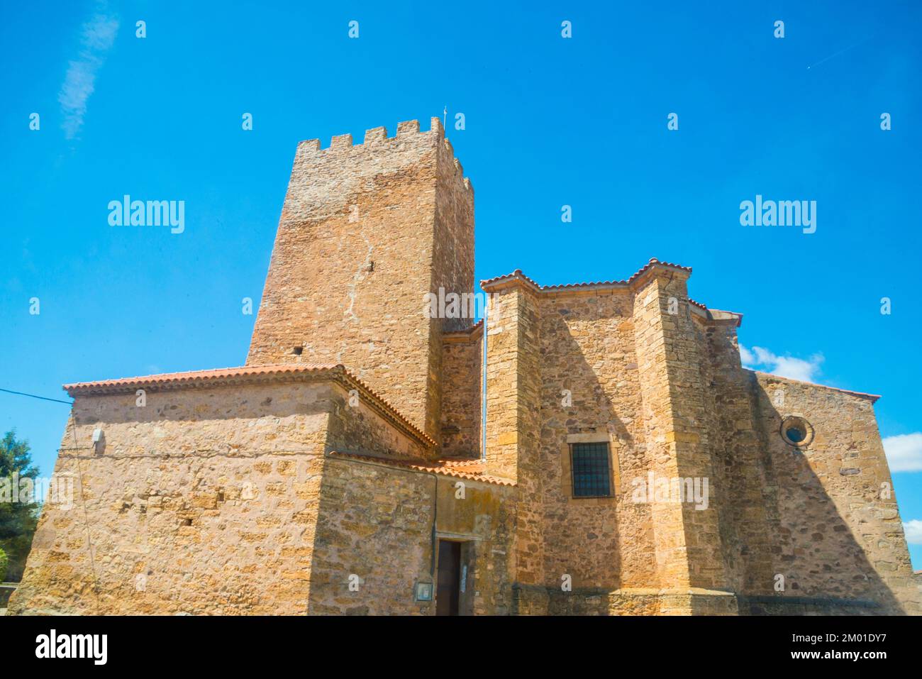 Church and medieval tower. Trebago, Soria province, Castilla Leon, Spain. Stock Photo