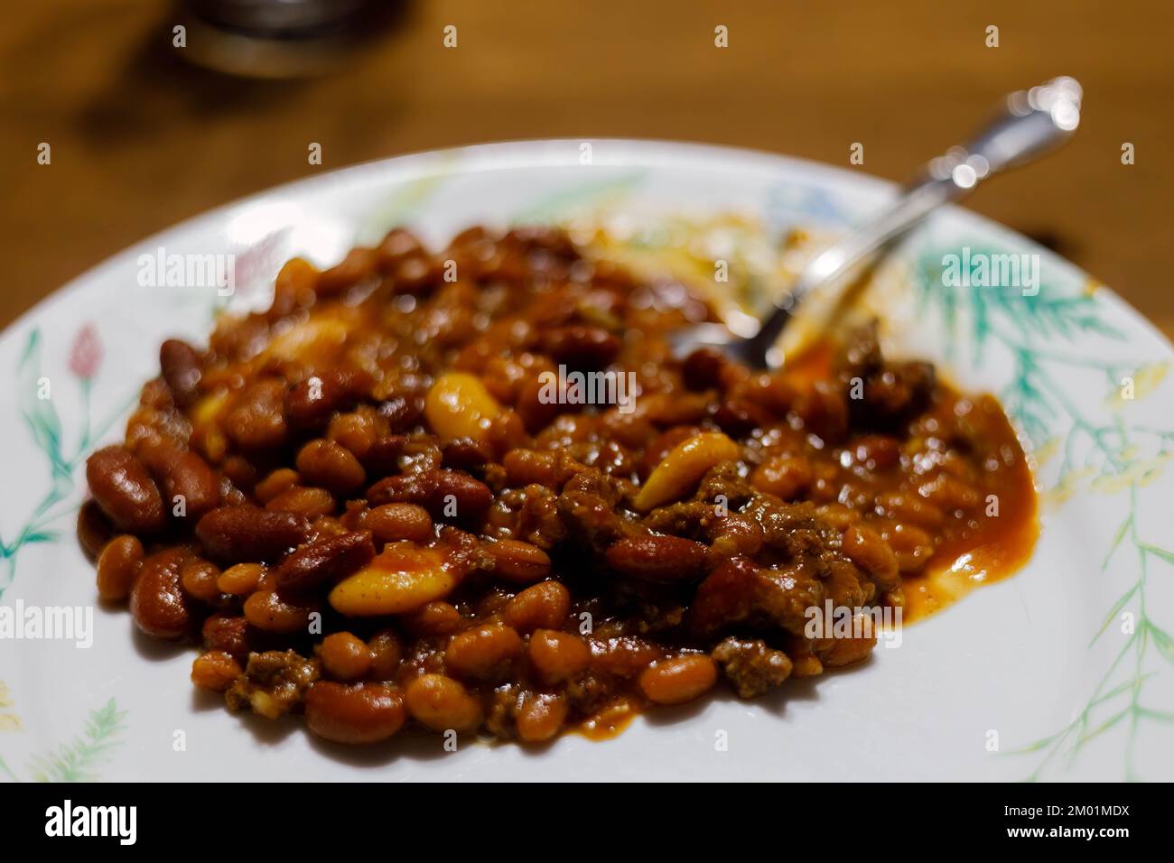 plate full of Three Bean Casserole hot from the oven and ready to eat Stock Photo