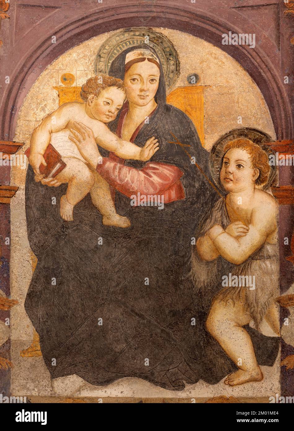 AOSTA, ITALY - JULY 14, 2018: The fresco of Madonna with the saint St. John the Baptist in the Cathedral by unknown artist (1526 - 1530). Stock Photo