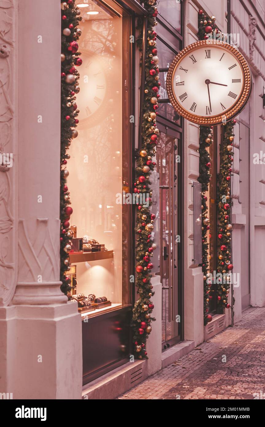 Clock shop with Christmas decor and illumination in Prague Stock Photo