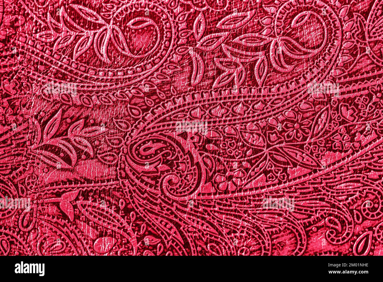 Texture of genuine leather embossed floral trend pattern, viva magenta color. Fashionable modern background Stock Photo