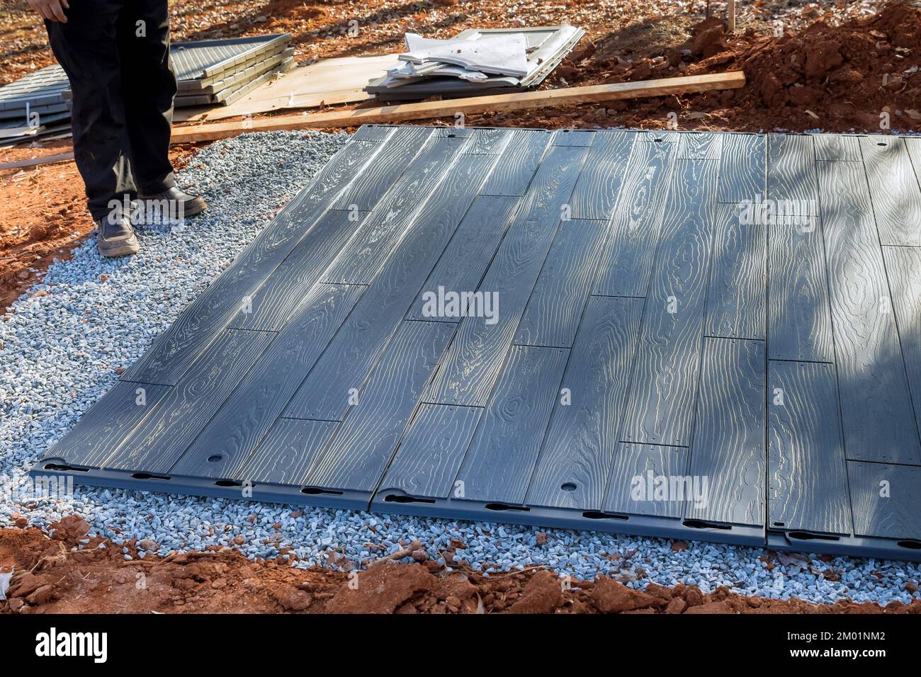 Process of putting plastic shed together for back yard in our backyard