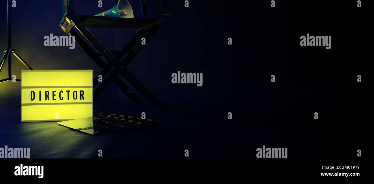 Director chair with cinema lightbox sign Director text on it and clapperboard megaphone and