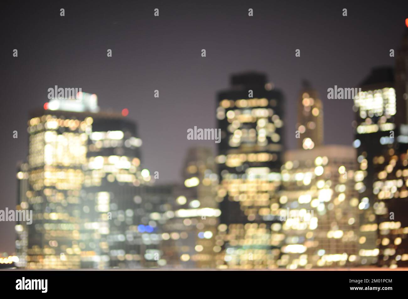 Blured background of New York skyscrapers at night Stock Photo - Alamy
