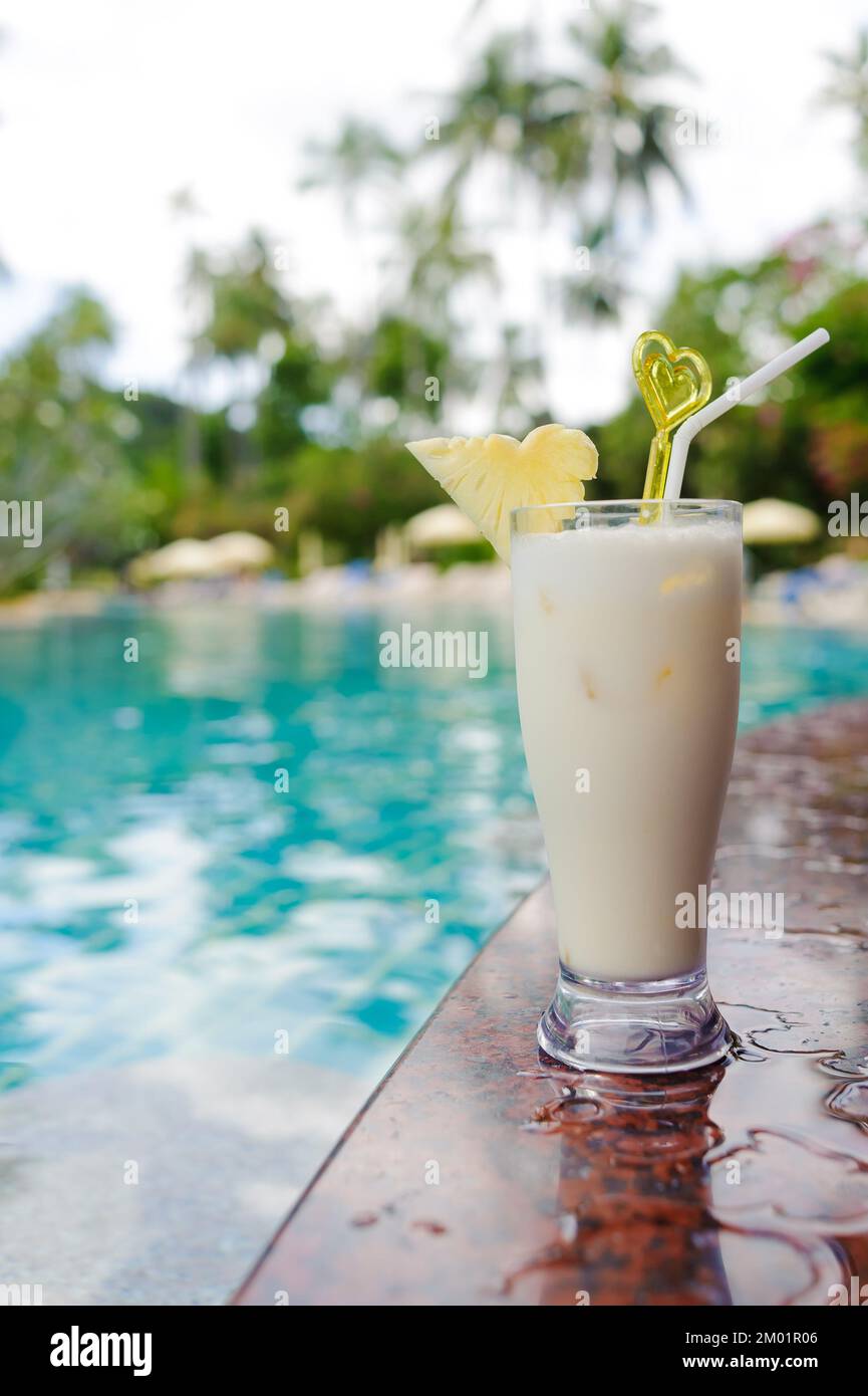cool refreshing coctail near swimming pool on vacation Stock Photo