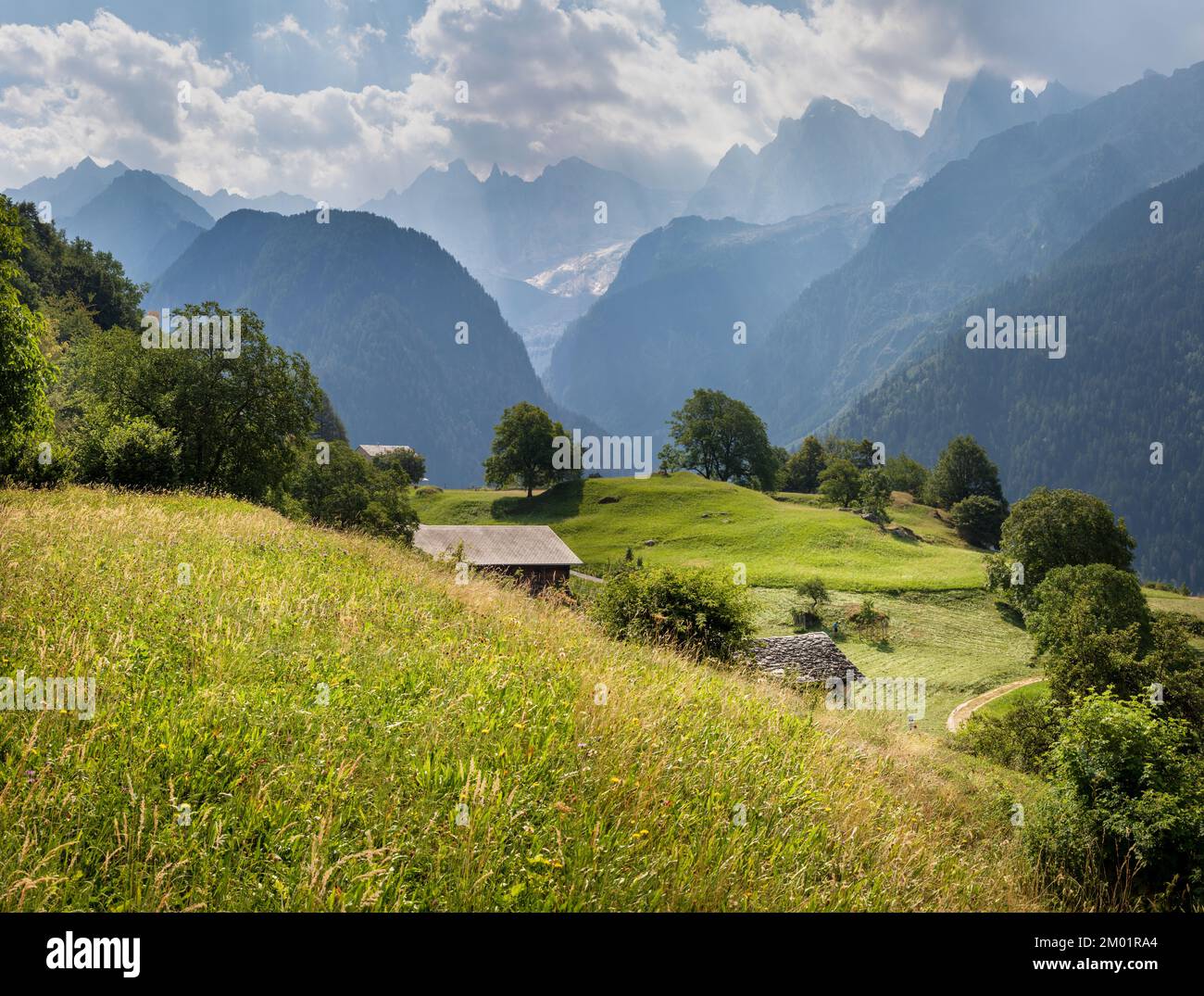 The Piz Badile, Pizzo Cengalo, and Sciora peaks in the Bregaglia range - Switzerland. Stock Photo