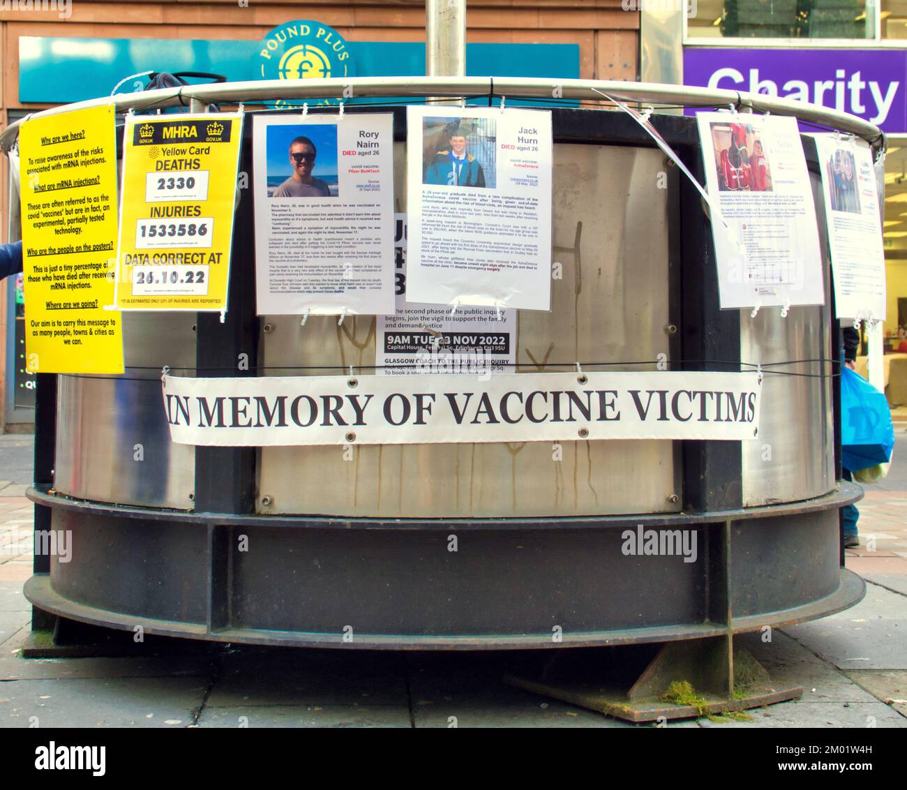 Glasgow, Scotland, UK 3rd December, 2022. Memory of vaccine victims protest on Argyle street saw the anti vax newspaper the light offered to passers by as they viewed the victims of the mrria scandal and info about vaccines and covid not available in the general media. Credit Gerard Ferry/Alamy Live News Stock Photo