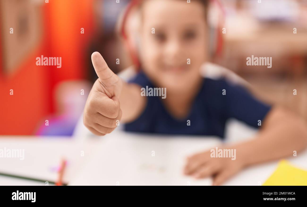 Hispanic boy finger painting Stock Photo - Alamy