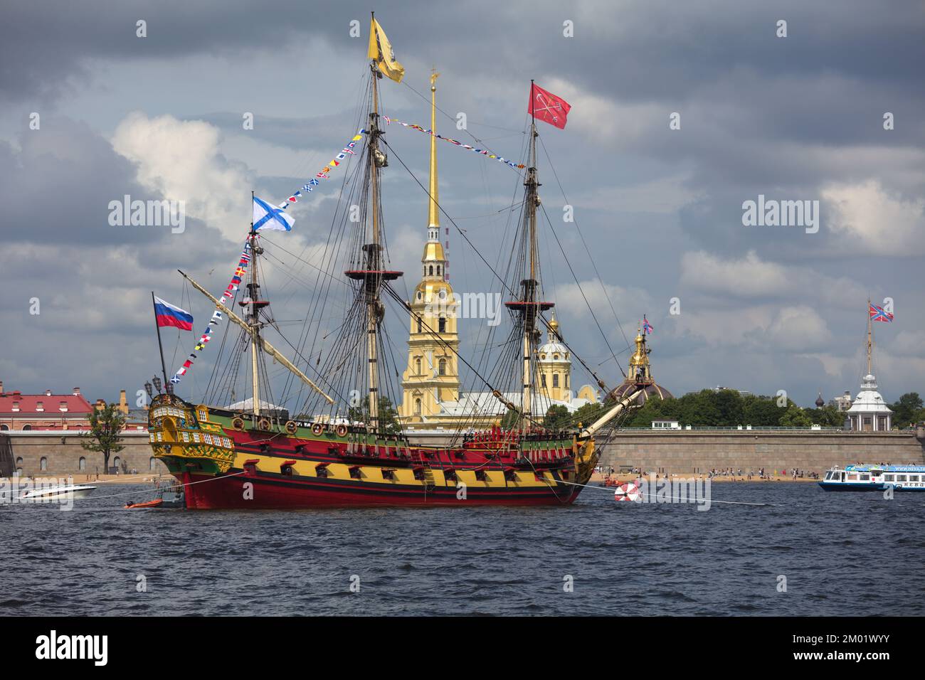 Ship of the line Poltava, the replica of historical ship, anchored in Neva river against St. Peter and Paul cathedral in St. Petersburg, Russia Stock Photo