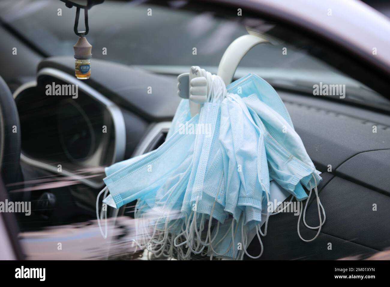 Bunch of medical face masks in a car Stock Photo