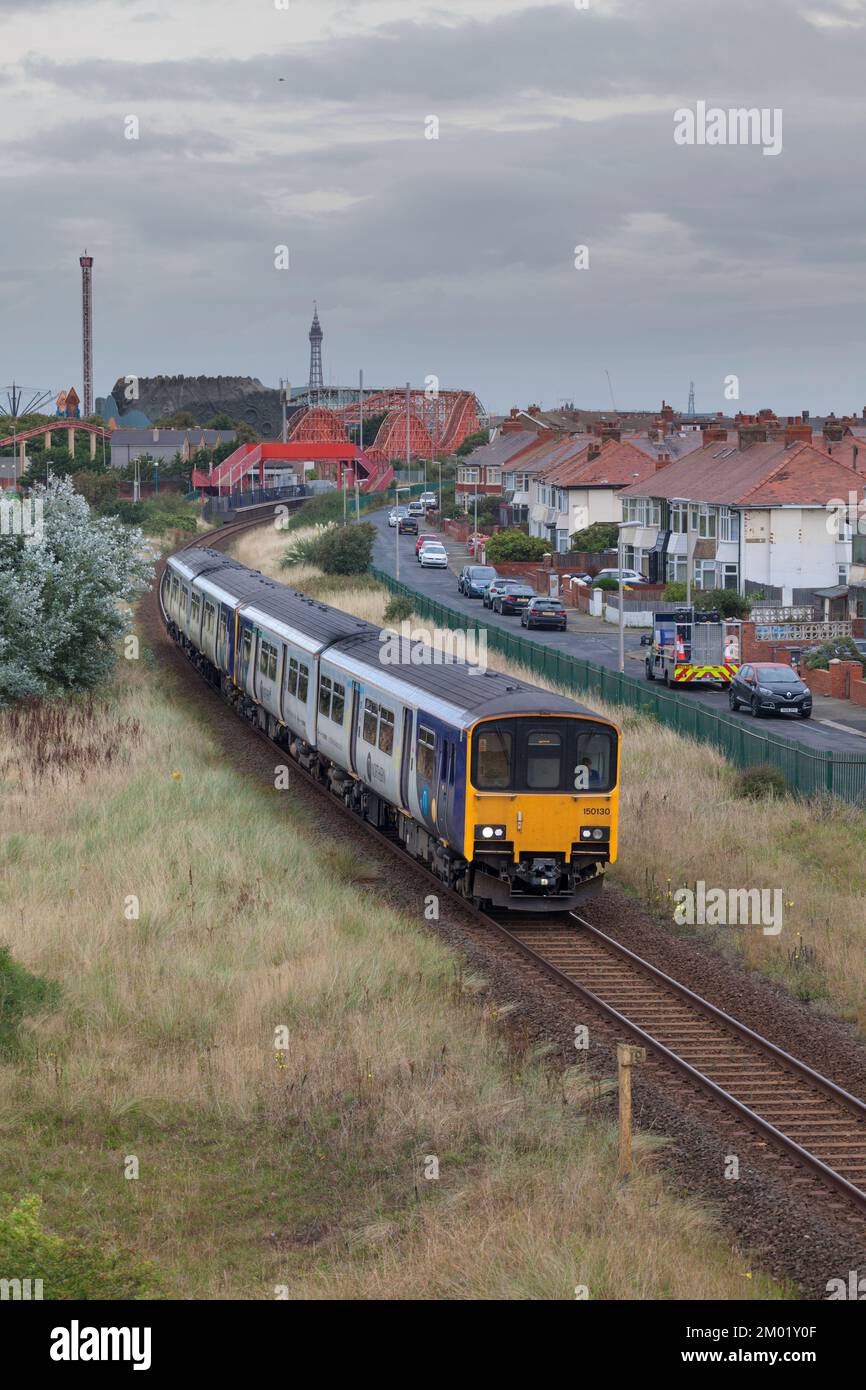 Northern Rail class 150 sprinter train on the single track south Fylde railway line to Blackpool south passing Blackpool Pleasure Beach Stock Photo