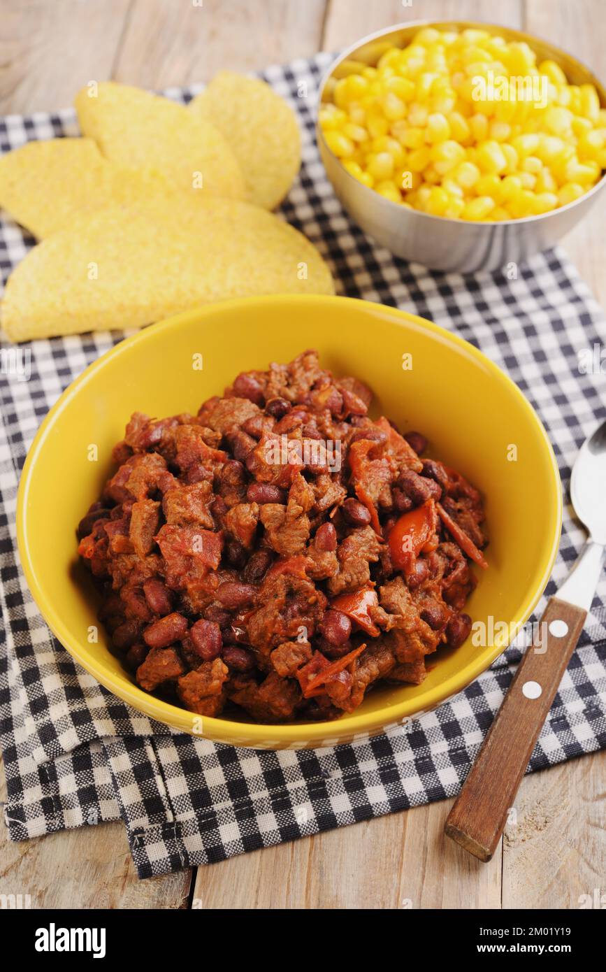 Chili con carne with corn and corn chips Stock Photo