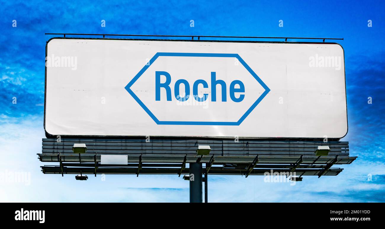 POZNAN, POL - OCT 28, 2022: Advertisement billboard displaying logo of Roche, a multinational healthcare company headquartered in Basel, Switzerland Stock Photo