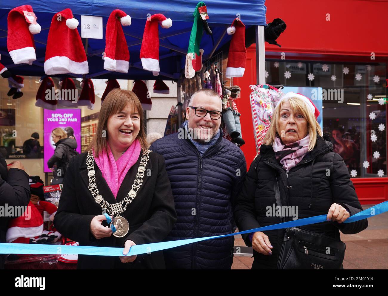 Lord Mayor of Dublin Caroline Conroy (right) along with Sadie Grace (right), Chairperson of the market, and Karl Mitchell of Dublin City Council, officially opens the Henry Street Christmas Market's in Dublin's city centre. This longstanding Christmas tradition is the oldest Christmas market in Dublin and has been a part of the city centre Christmas shopping experience over the last few decades. Picture date: Saturday December 3, 2022. Stock Photo