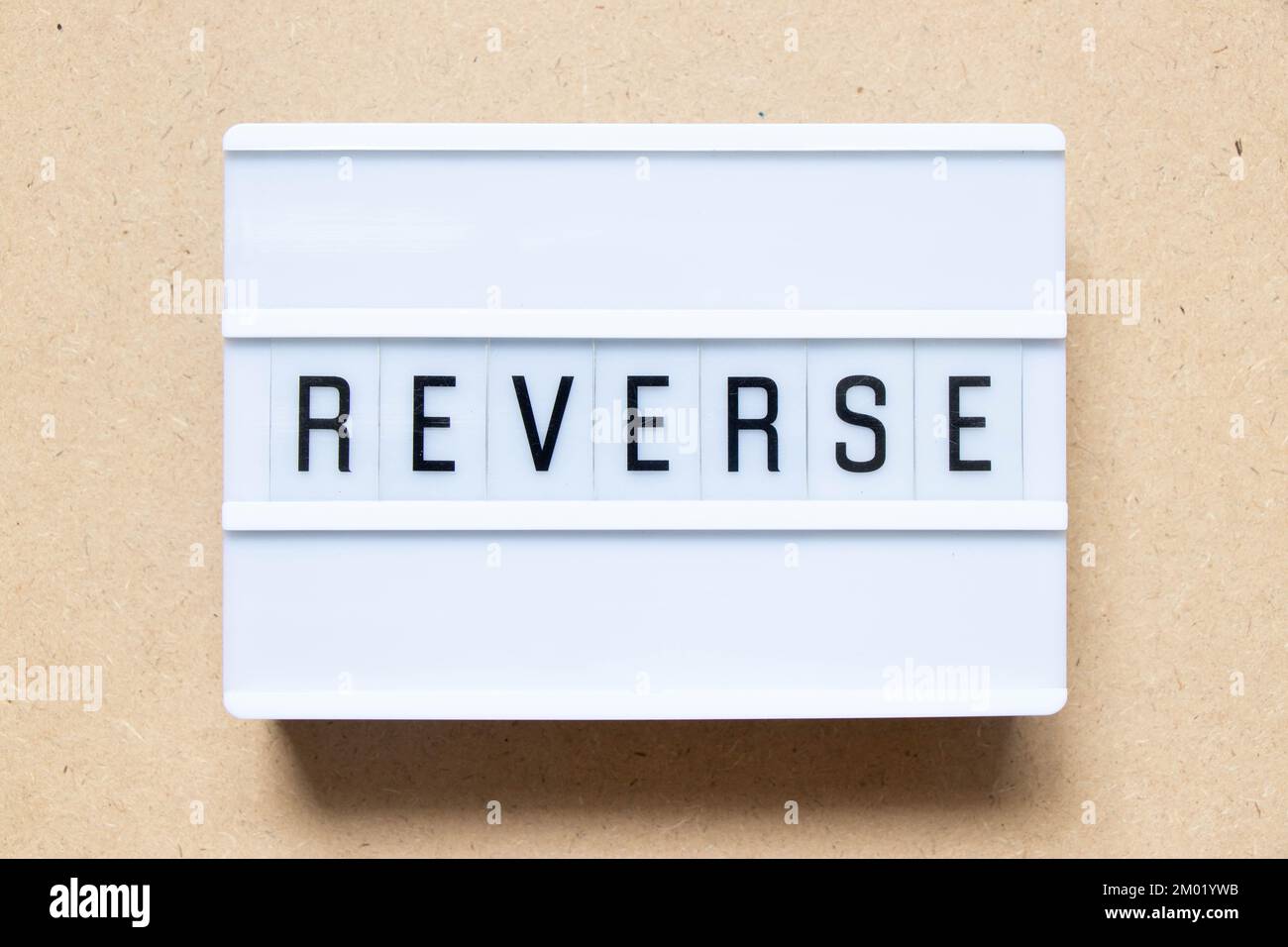 Lightbox with word reverse on wood background Stock Photo