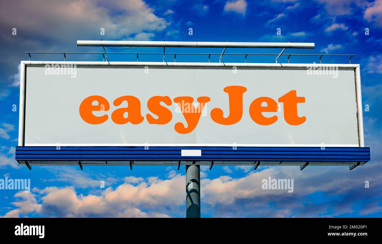 POZNAN, POL - JUN 23, 2022: Advertisement billboard displaying logo of EasyJet, a British low-cost airline group headquartered at London Luton Airport Stock Photo