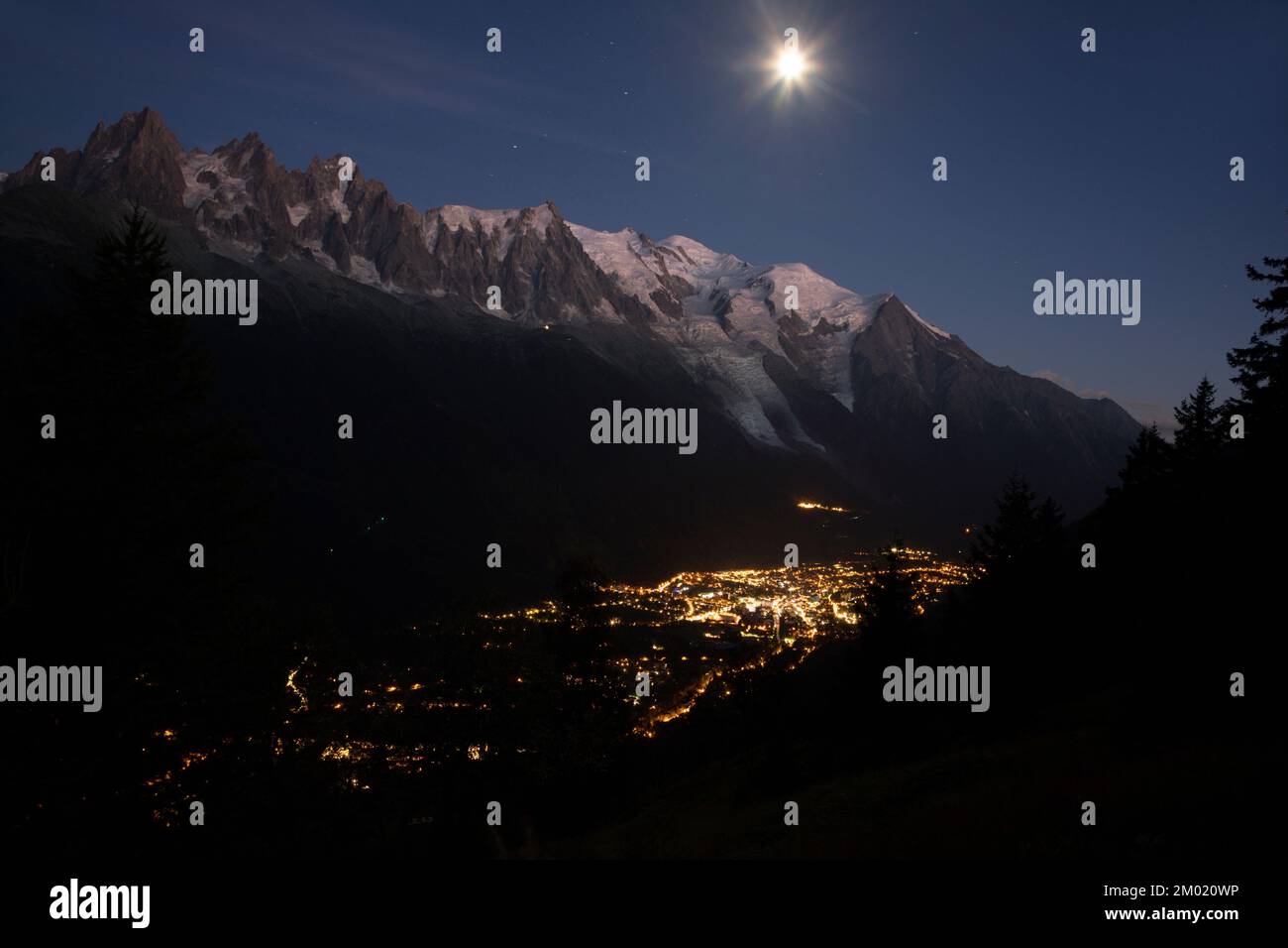 The Mont Blanc massif  and Chamonix in the moon light. Stock Photo
