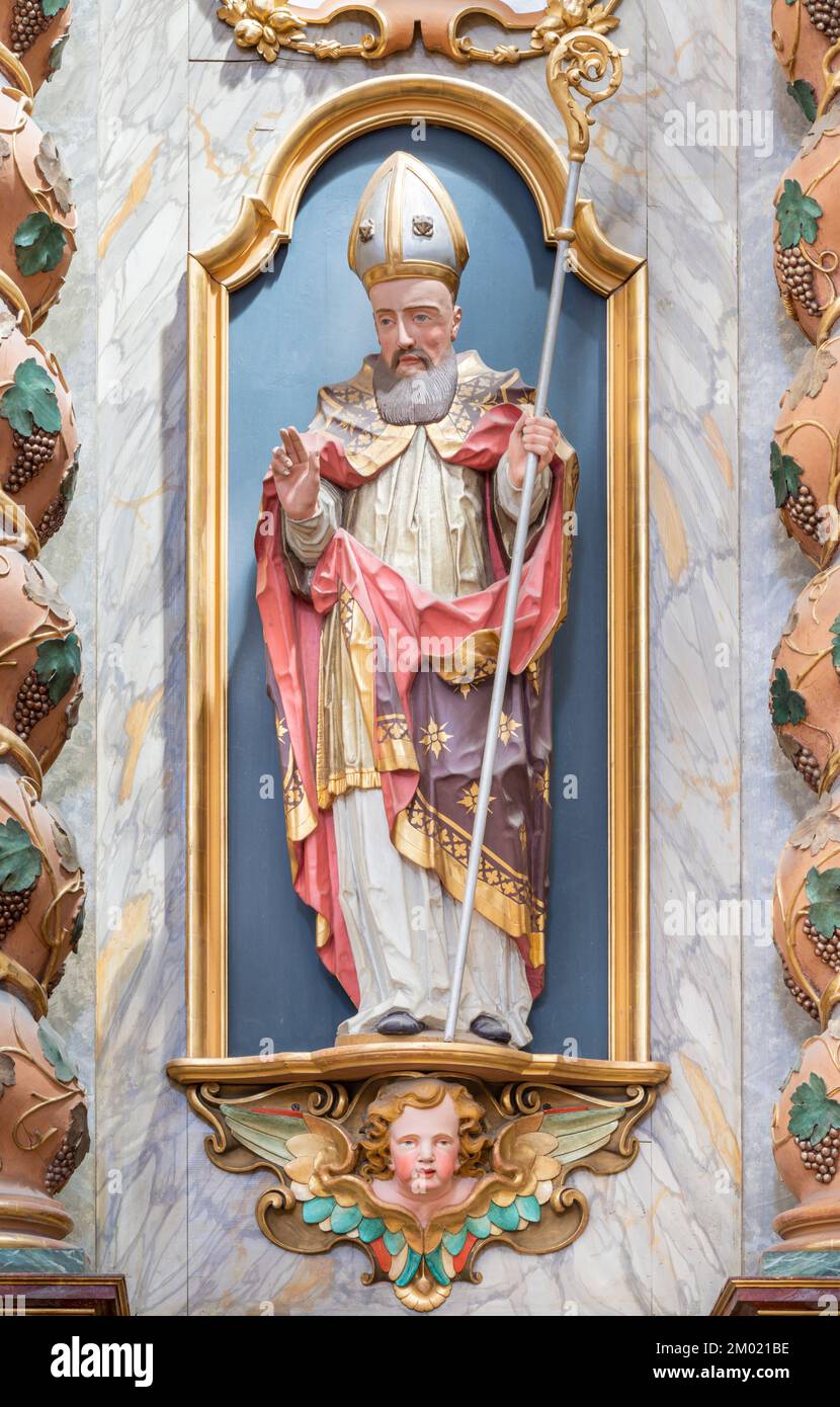 ANNECY, FRANCE - JULY 10, 2022: The baroque carved polychrome satue of St. Francis de Sales in the church Eglise Saint François De Sales. Stock Photo