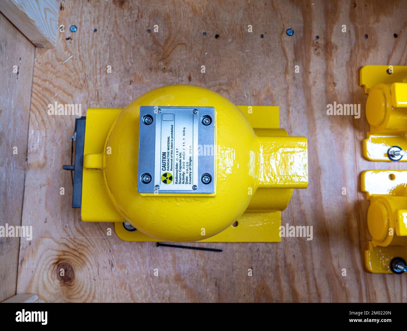 Radiation warning sign on the nameplate the mechanical container of