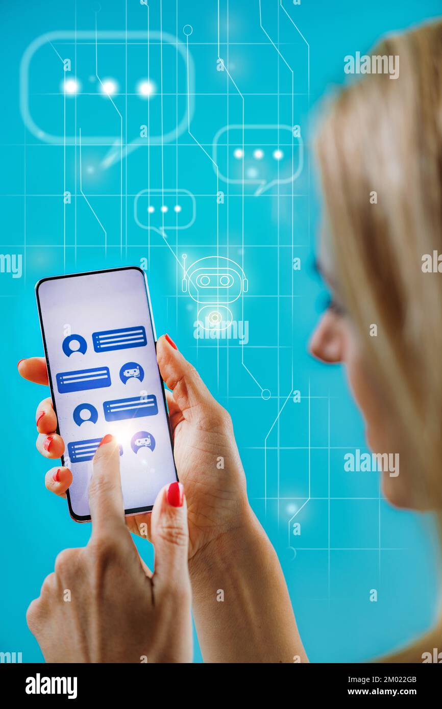 Customer using a chatbot on a smartphone. Stock Photo
