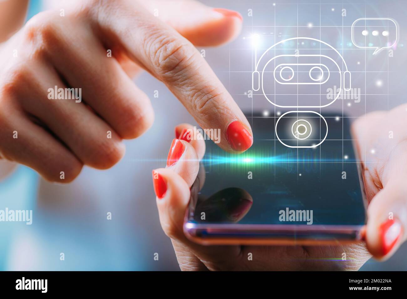 Woman using a digital chatbot on a smartphone Stock Photo