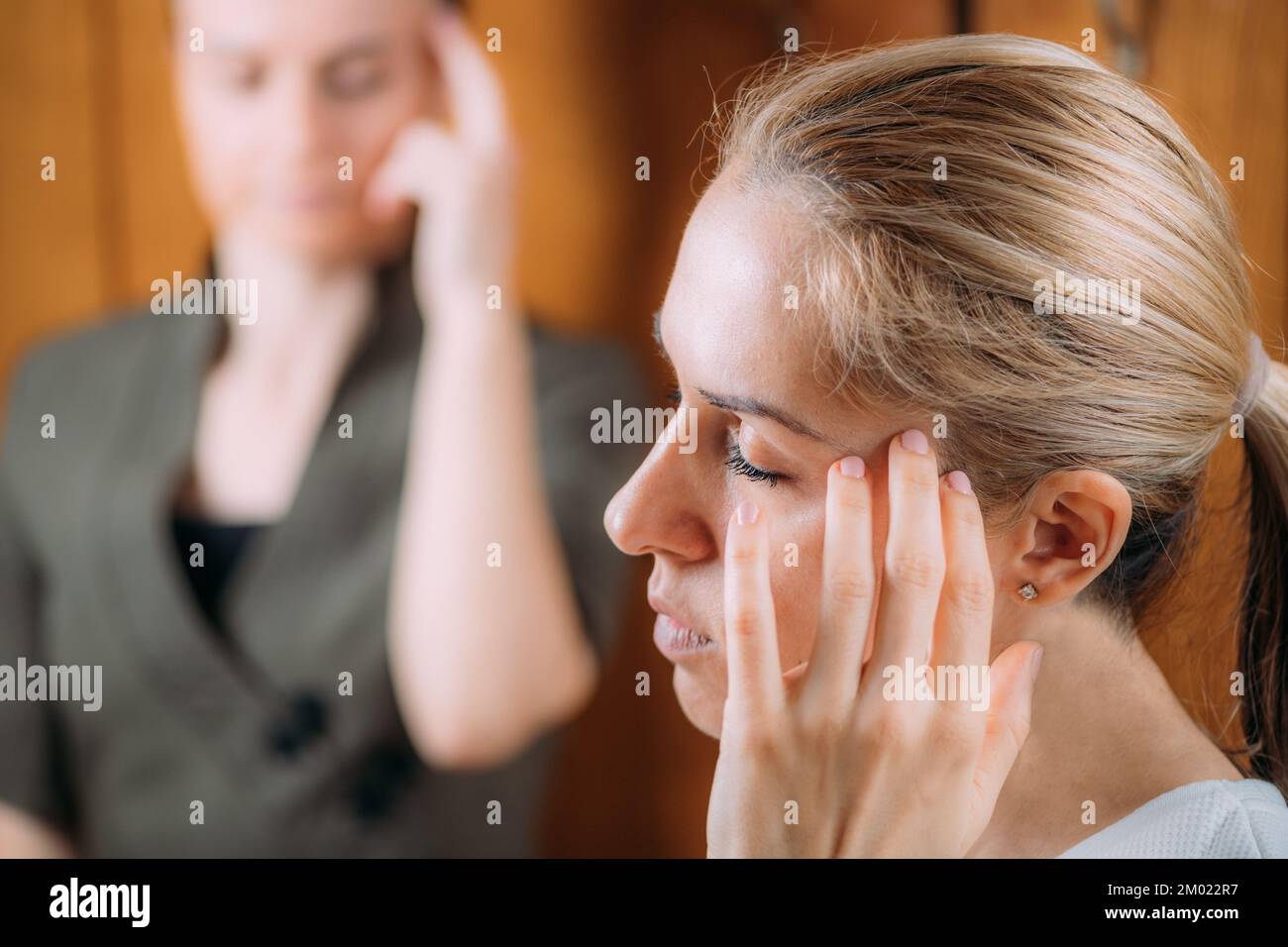EFT head tapping technique Stock Photo Alamy