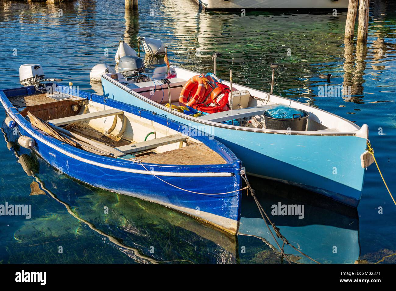 Traditional fishing boat with fishing gear nets buoys lamp that is used on  the Garda lake Italy Stock Photo - Alamy