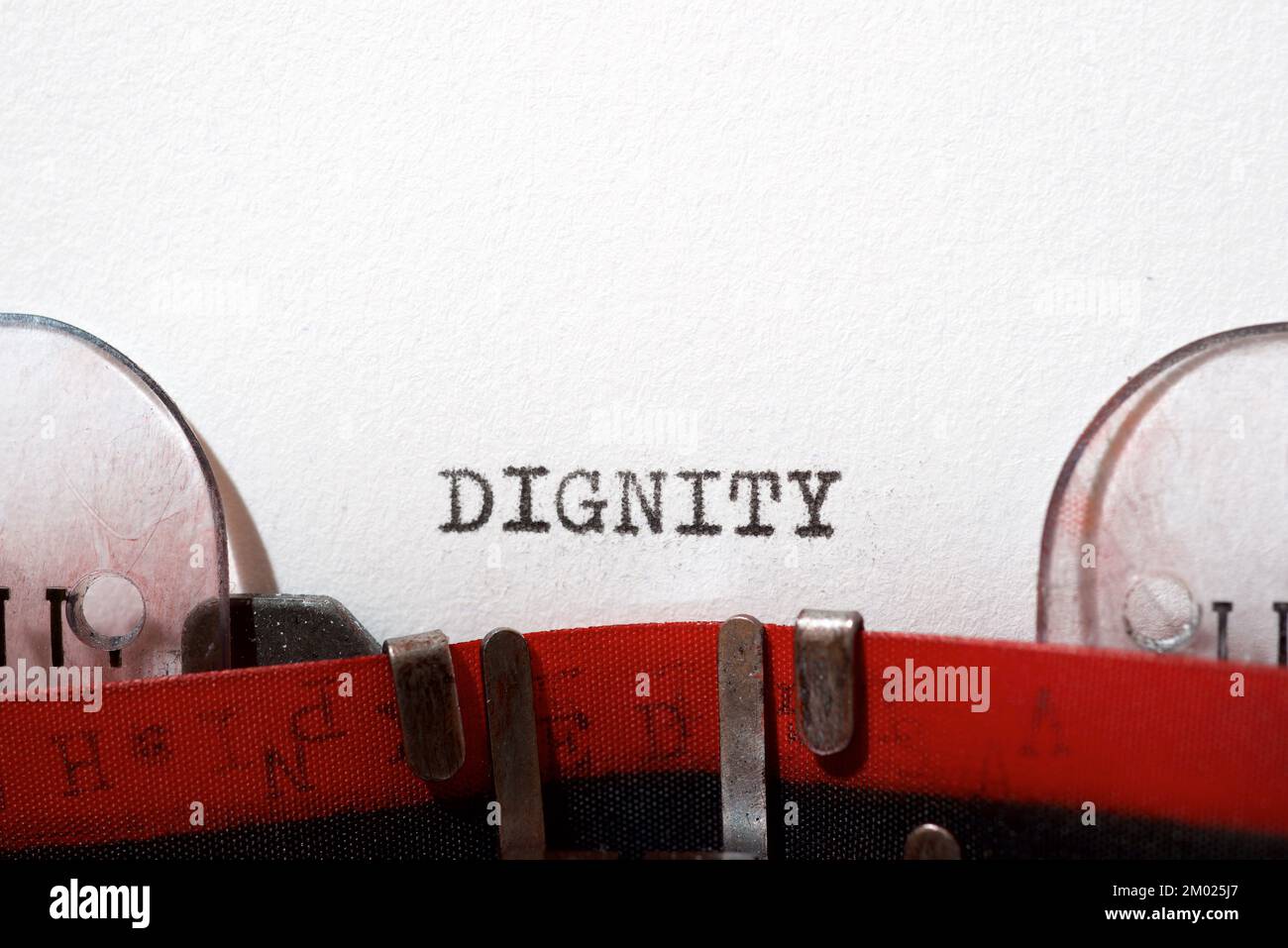 Dignity text written with a typewriter Stock Photo - Alamy